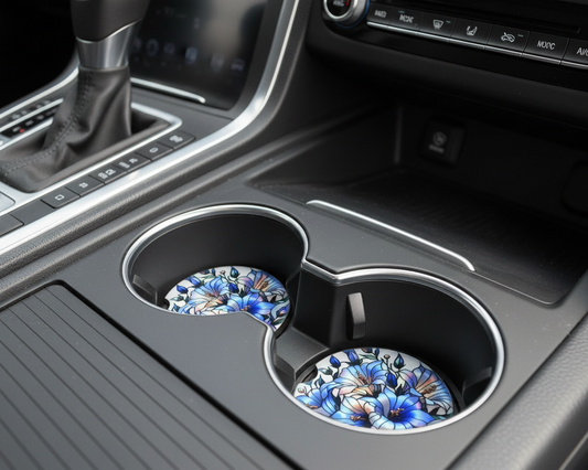 Car cup holder with decorative coasters on a vehicle's center console.