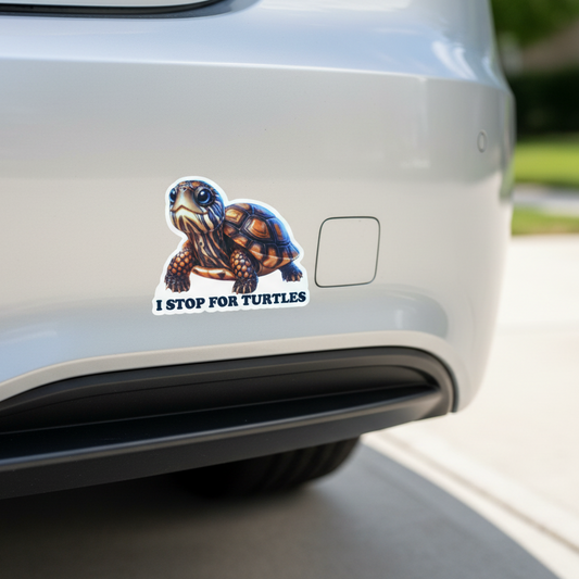 Car bumper with a sticker of a turtle and text 'I STOP FOR TURTLES'