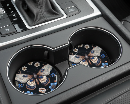 Car cup holders with Moth-patterned coasters on a vehicle interior background.