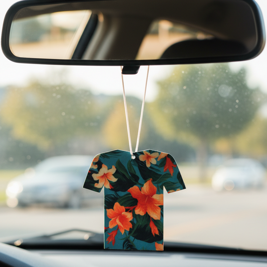 Floral-patterned car air freshener hanging from a car's rearview mirror.